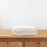 SHORT PRE ORDER New Grain quilted blanket | crib - Natural